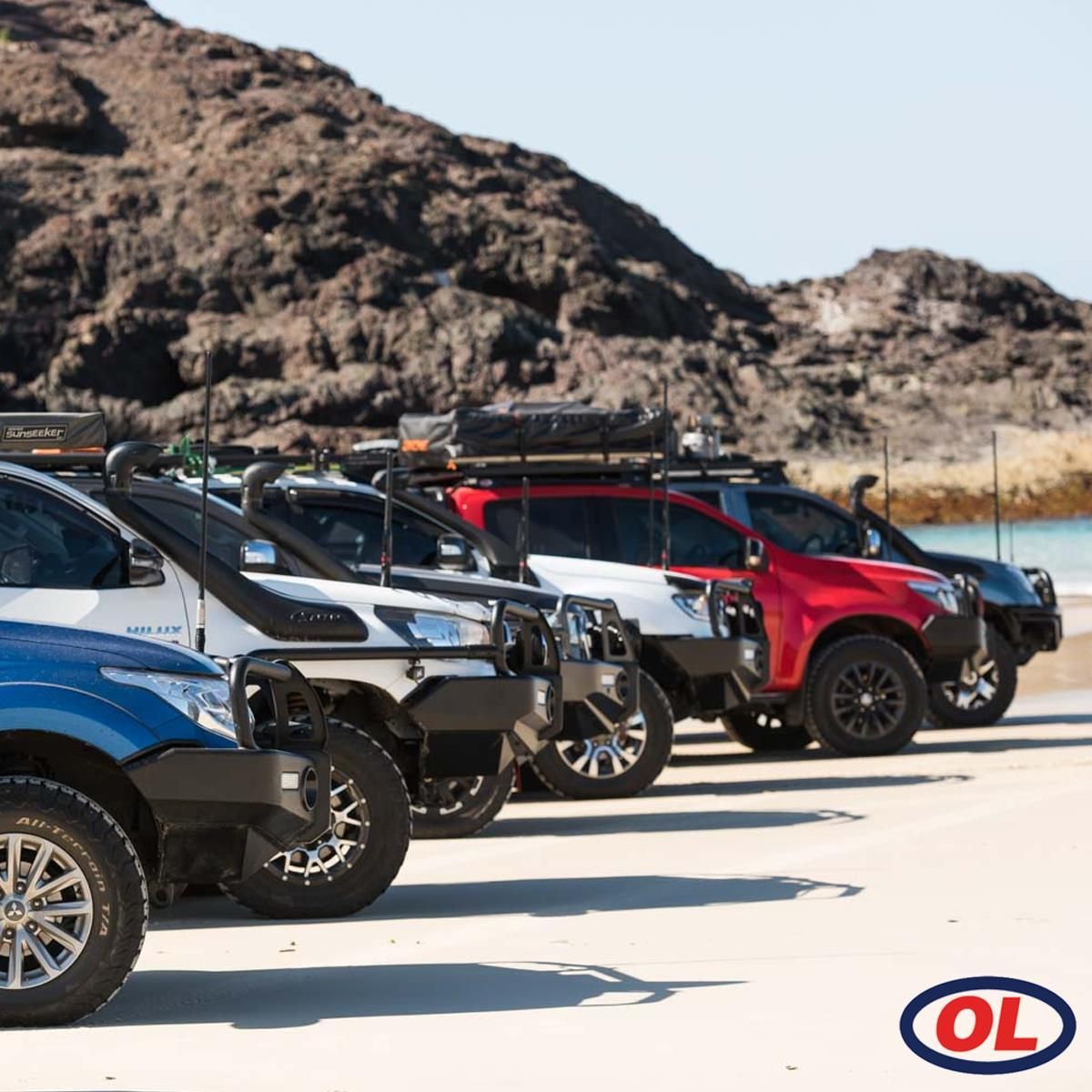 A Row Of Cars Parked On A Beach — Opposite Lock In Wodonga, VIC