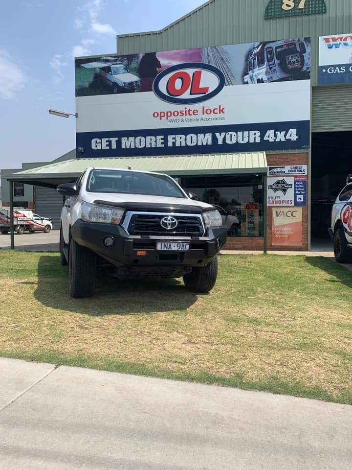 A White Truck Is Parked In Front Of A Building — Opposite Lock In Wodonga, VIC