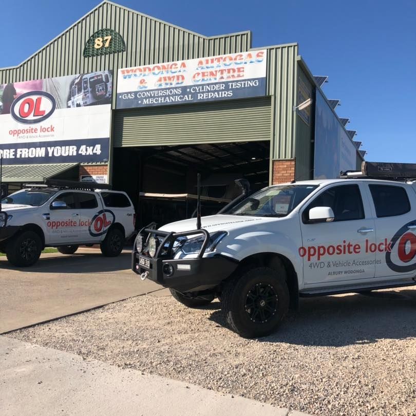 Two Opposite Lock Vehicles Are Parked In Front Of A Building — Opposite Lock In Wodonga, VIC