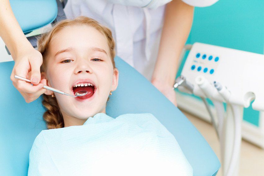 A young girl has a dental examination at St John's Hill Dental Practice, Shrewsbury