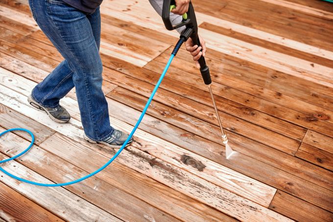 Pressure Washer Cleaning a Weathered Deck - Savannah, GA - Squeaky Clean