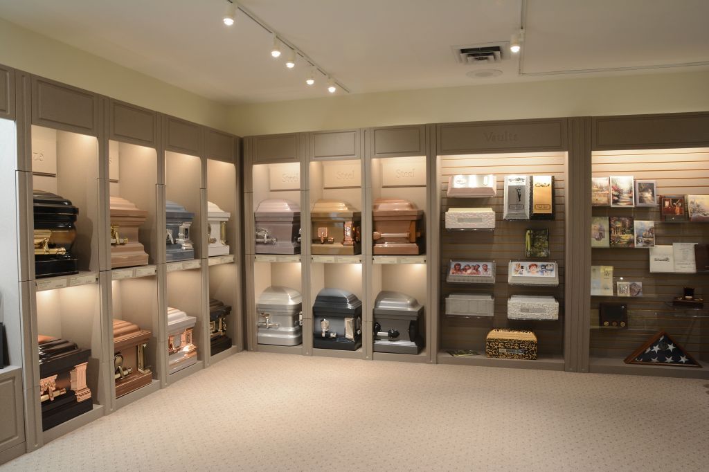 A room with a lot of coffins on shelves