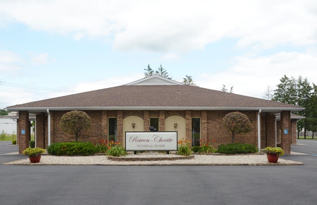 A brick building with a sign in front of it that says home sweet home