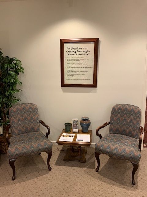 A waiting room with two chairs and a table