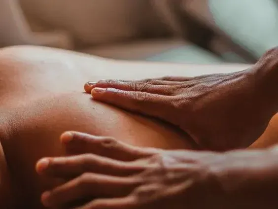 A person is getting a massage on their back