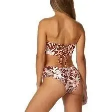 The back of a woman in a bikini on a white background