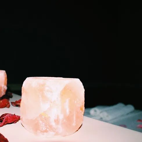 A close up of a candle holder on a table.