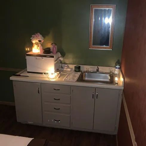 A kitchen with a sink and a toaster oven