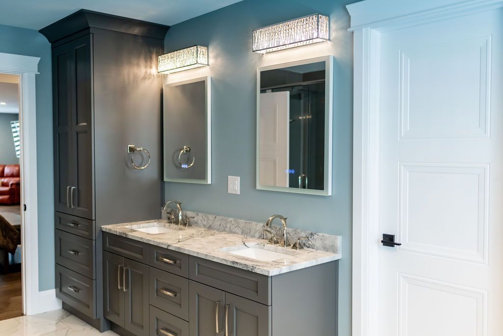 A bathroom with two sinks and two mirrors.