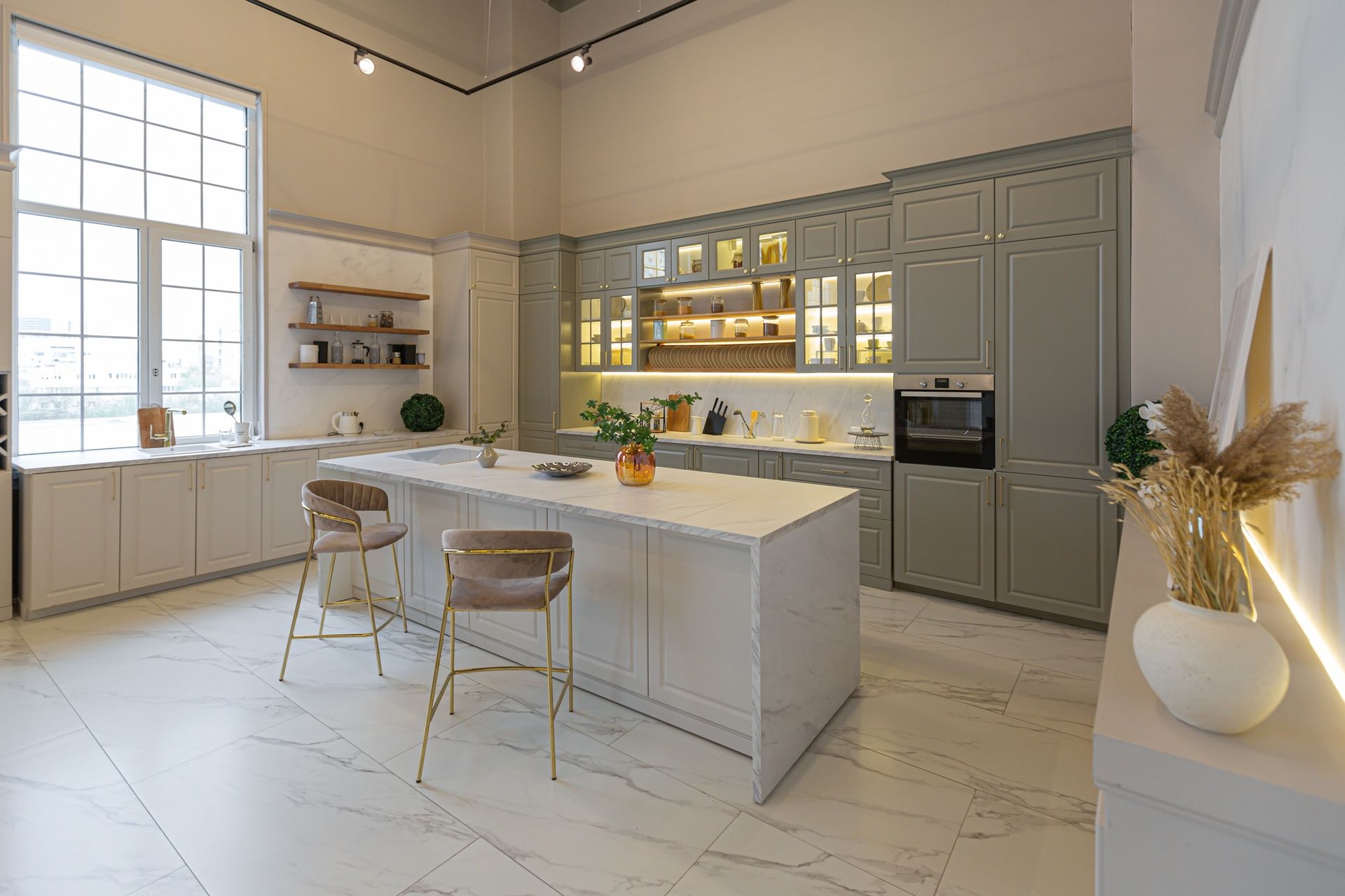 A kitchen with a large island in the middle of the room.