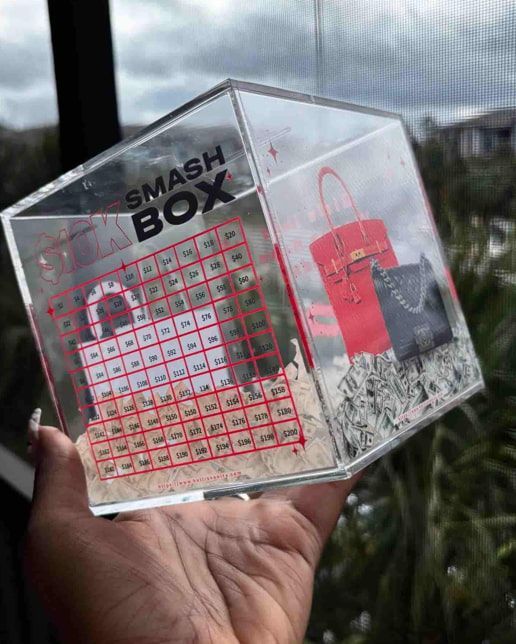 A person is holding a smash box in their hand.