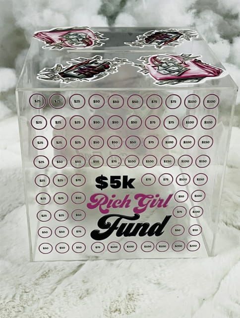A clear cube with the words $ 5k rich girl fund on it