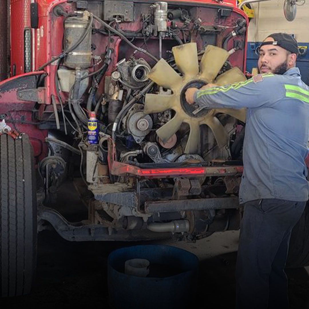 Technician repairing diesel engine on semi-truck in Wallington NJ near Carlstadt and Rutherford.