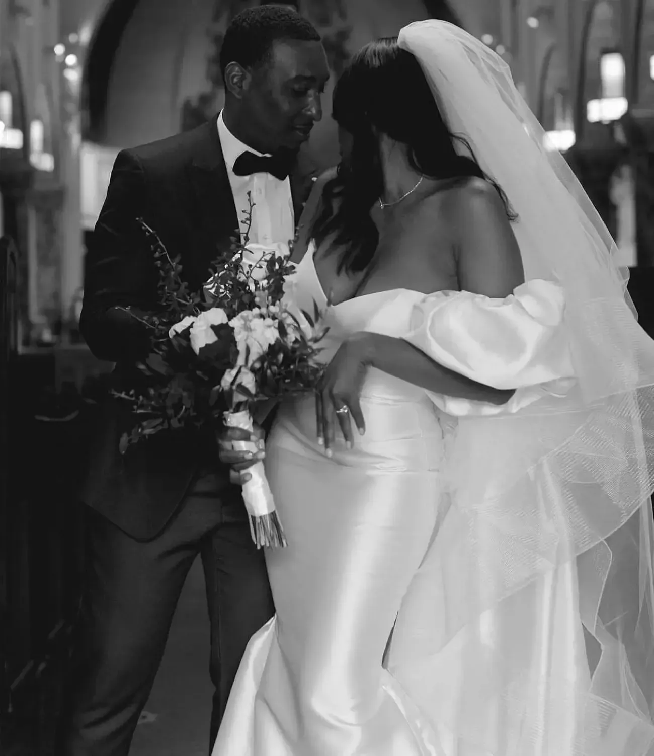 A black and white photo of a bride and groom