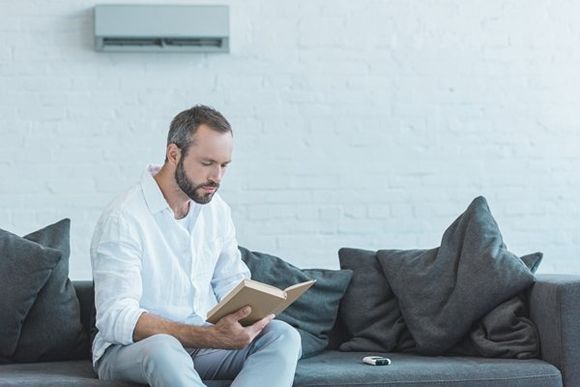 Man Reading a Book — Boone NC — Boone Heating & Air Conditioning Inc