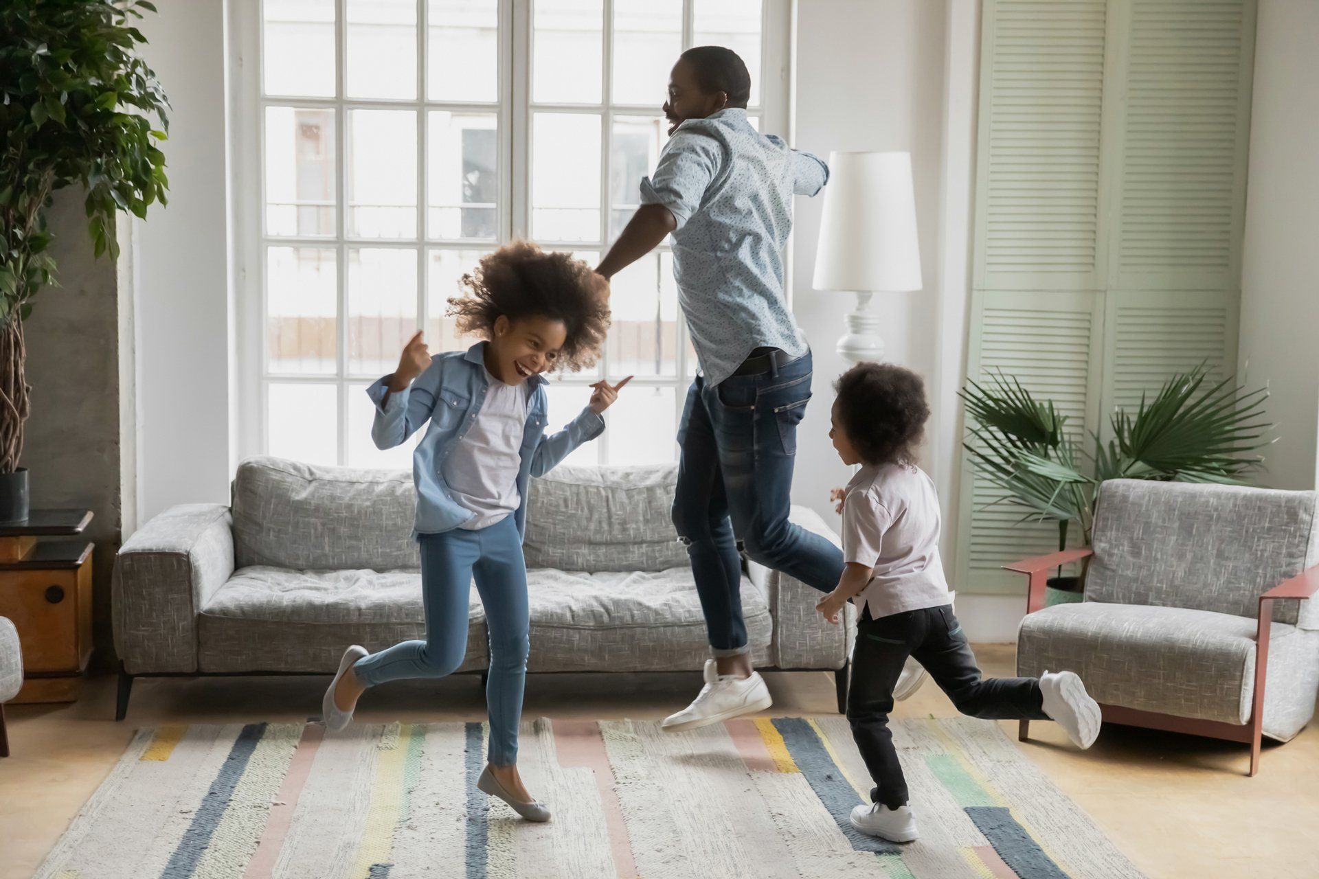 Happy Family Dancing — Boone NC — Boone Heating & Air Conditioning Inc