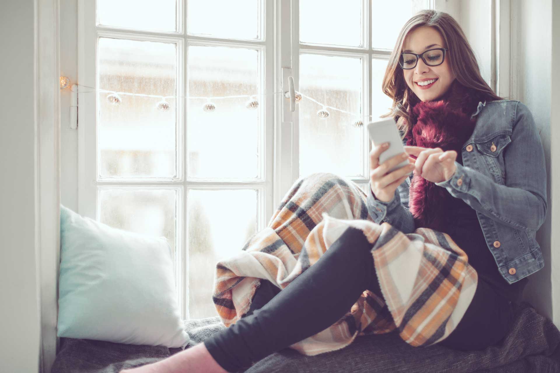 Young woman at home — Boone NC — Boone Heating & Air Conditioning Inc