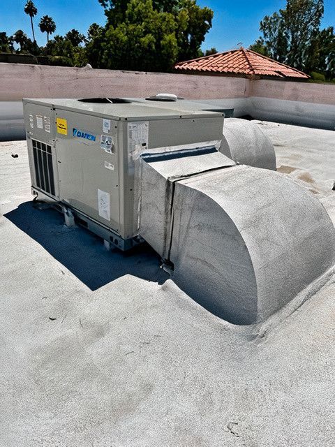 A tanco air conditioner is on the roof of a building