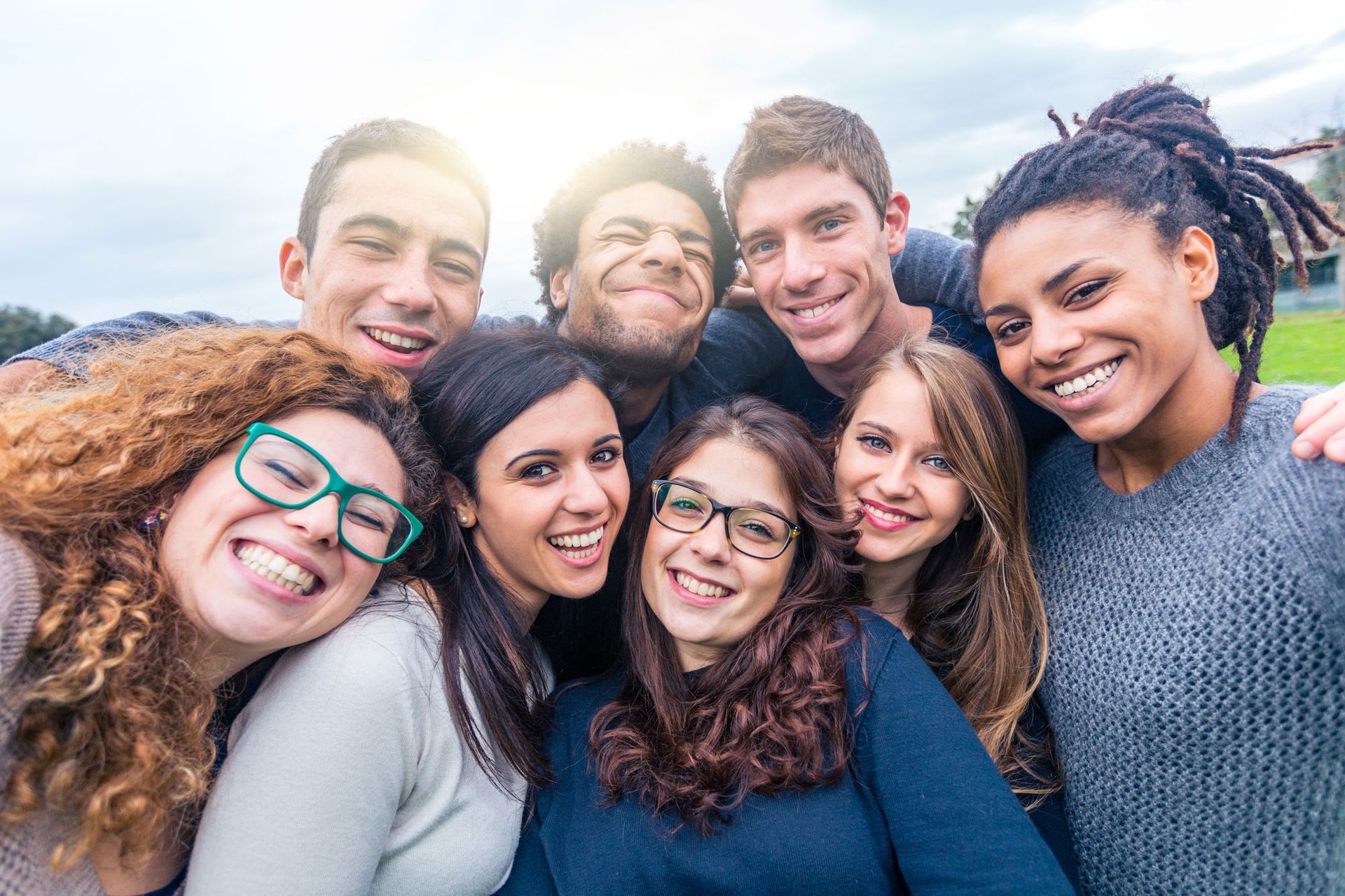 group of multi-racial people smiling at camera