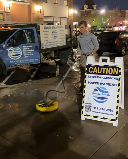 A man standing next to a sign that says caution