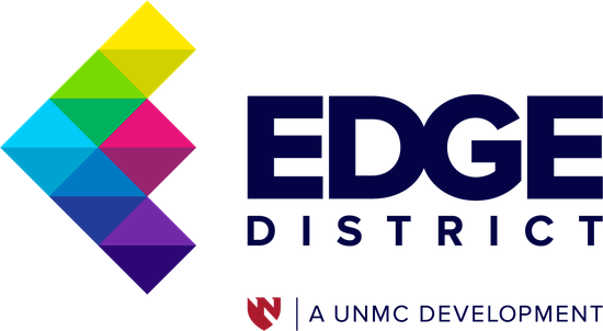 Logo for Edge District, a UNMC development, with a colorful geometric shape and dark blue text.