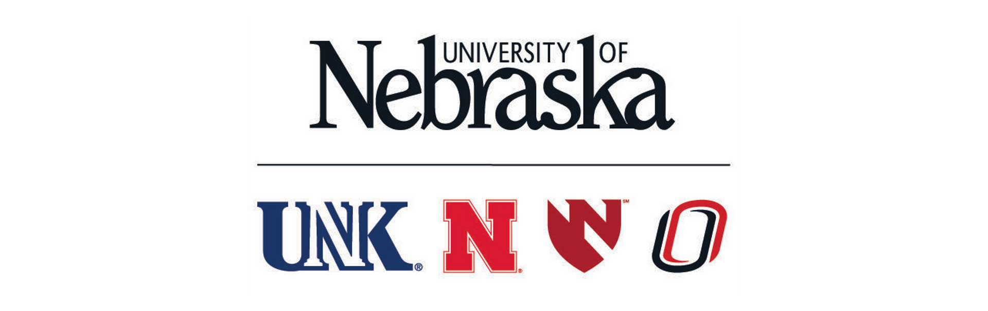 Audience in a conference room listening to a presenter, with art on the walls.