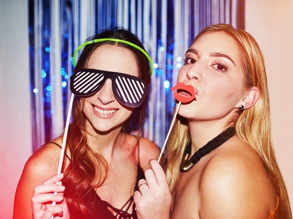 Image of two girls with props