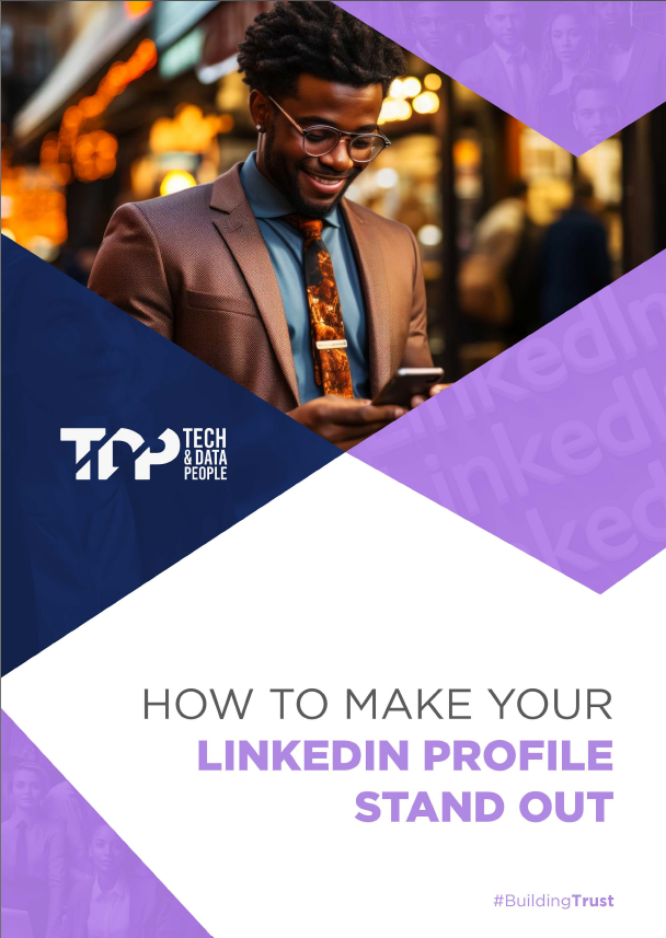 A man in a suit and tie is looking at his phone