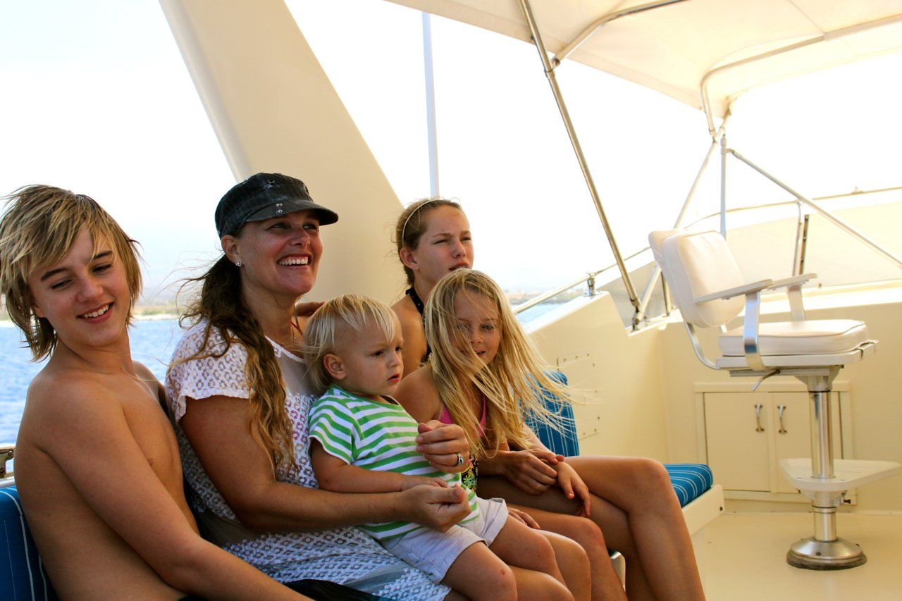A group of people are sitting on a boat.