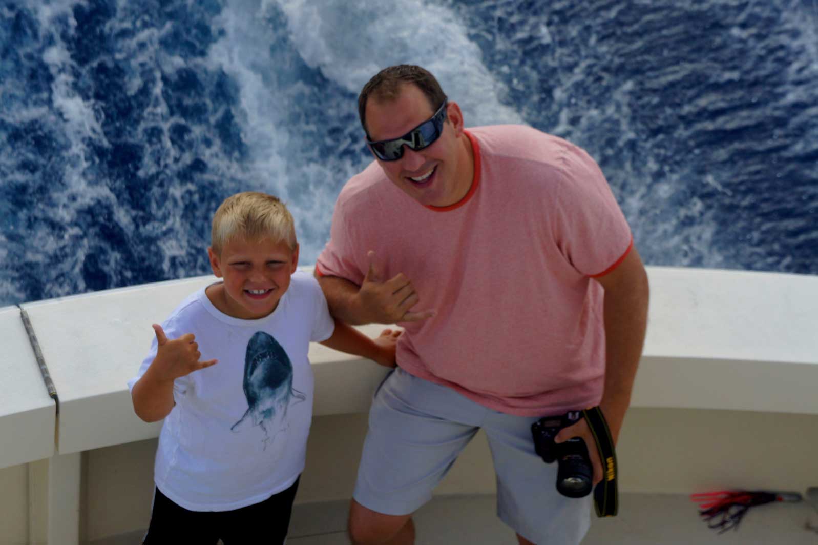 Silky Fishing Charter Boat father son fishing together