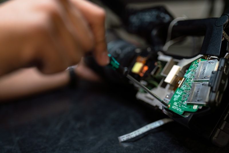Aerospace engineer working on satellite ground system electronics — designAmerica supporting mission-critical clients