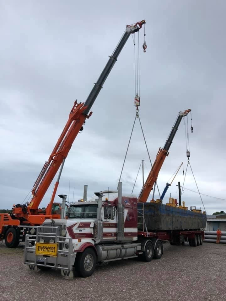 A Truck Is Being Lifted By A Crane — Port Stephens Cranes In Salt Ash, NSW