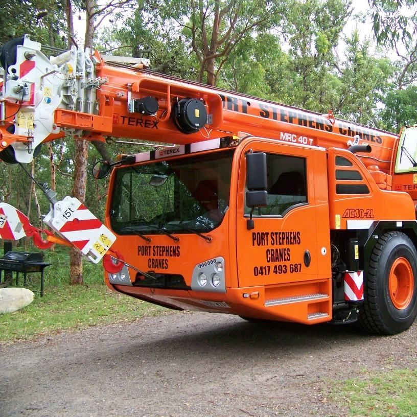 An Orange Truck That Says Port Stephens Crane On It — Port Stephens Cranes In Salt Ash, NSW