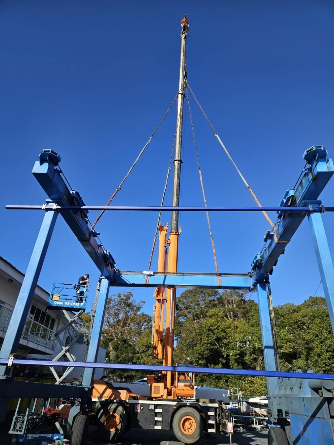 A Large Crane Is Sitting On Top Of A Blue Structure — Port Stephens Cranes In Salt Ash, NSW