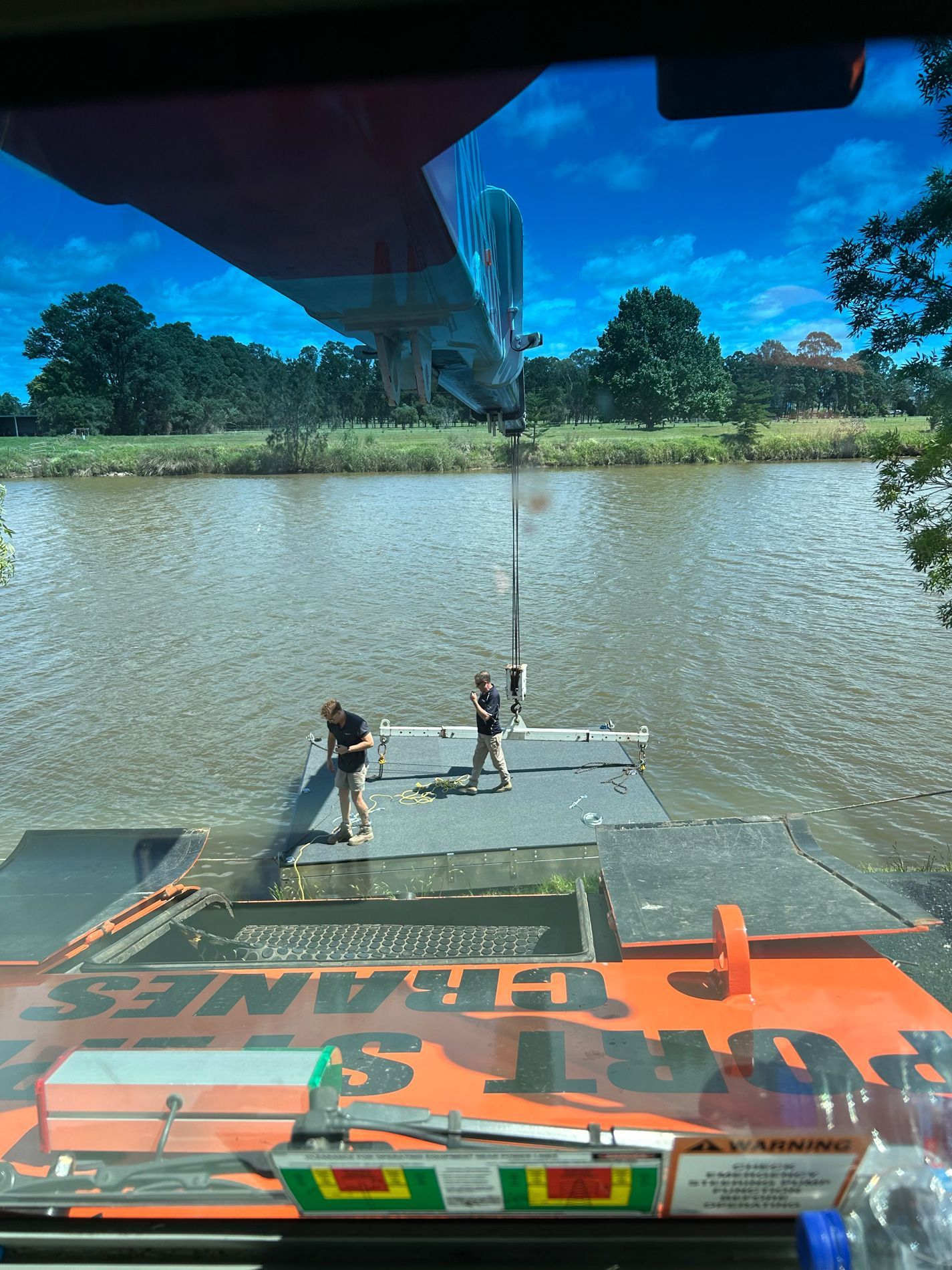 Image taken from person sat in Crane of workers