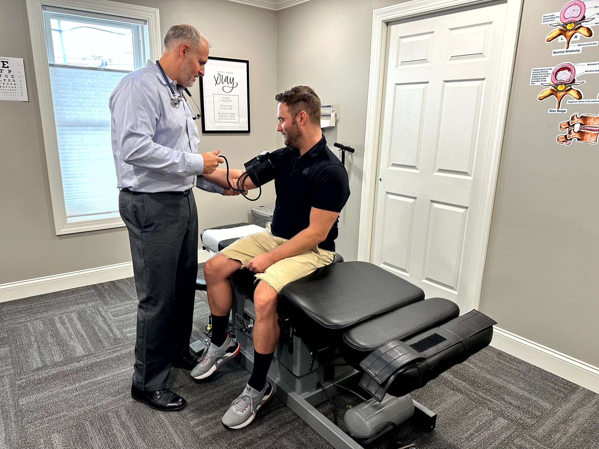 Dr. Nate taking a patient's blood pressure for a CDL exam