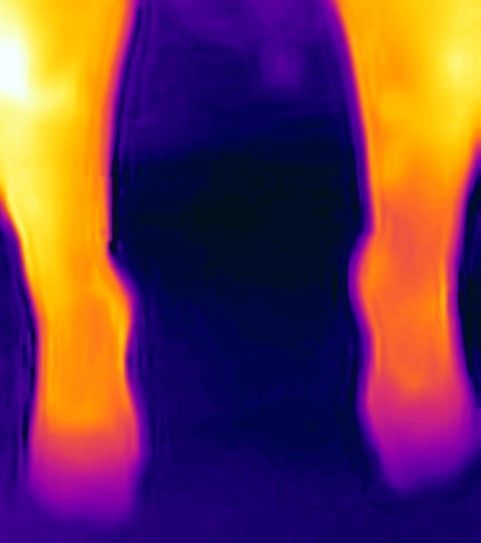 It looks like a thermal image of a person 's feet.