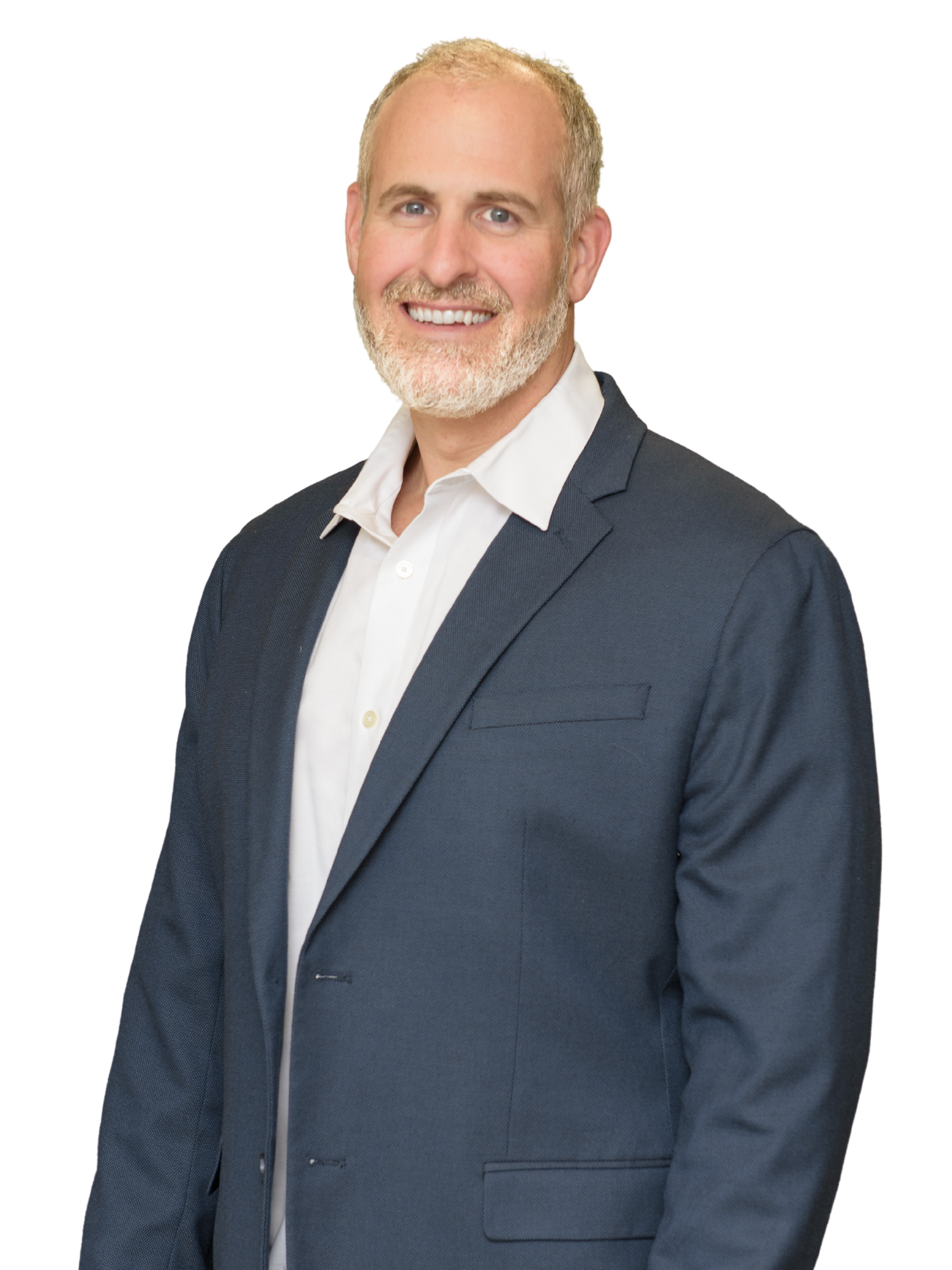 A man in a suit and white shirt is smiling for the camera