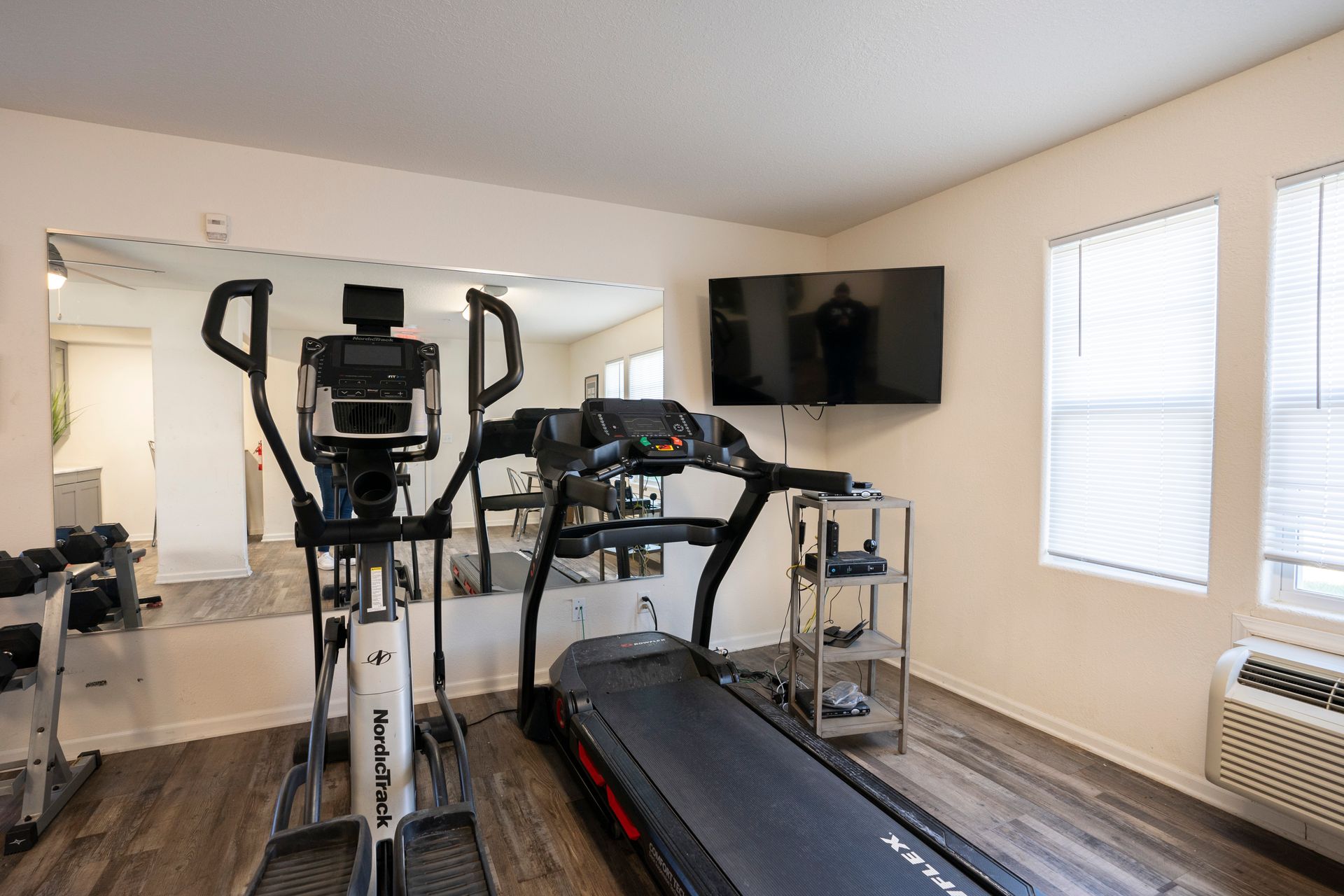 Exercise gym at apartments on 6th. Treadmill.