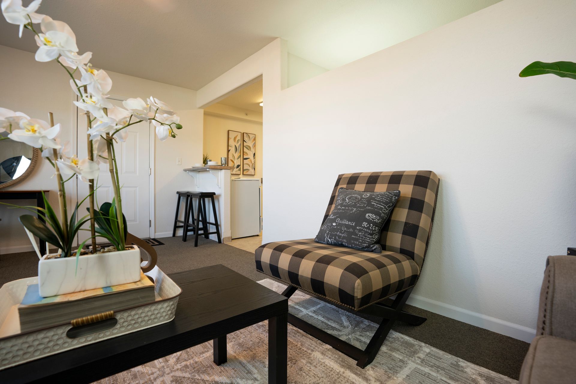 Different view of pretty room with white walls and nice furniture
