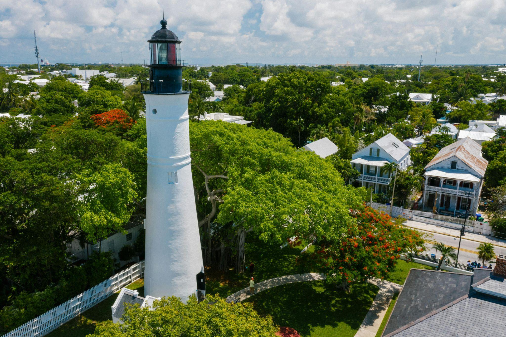 Aerial view of a lighthouse and surrounding houses in Key West