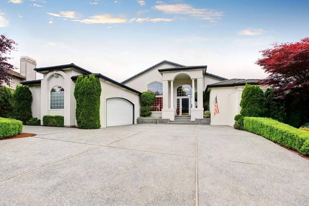 A large white house in Essex with a large resin driveway leading to it