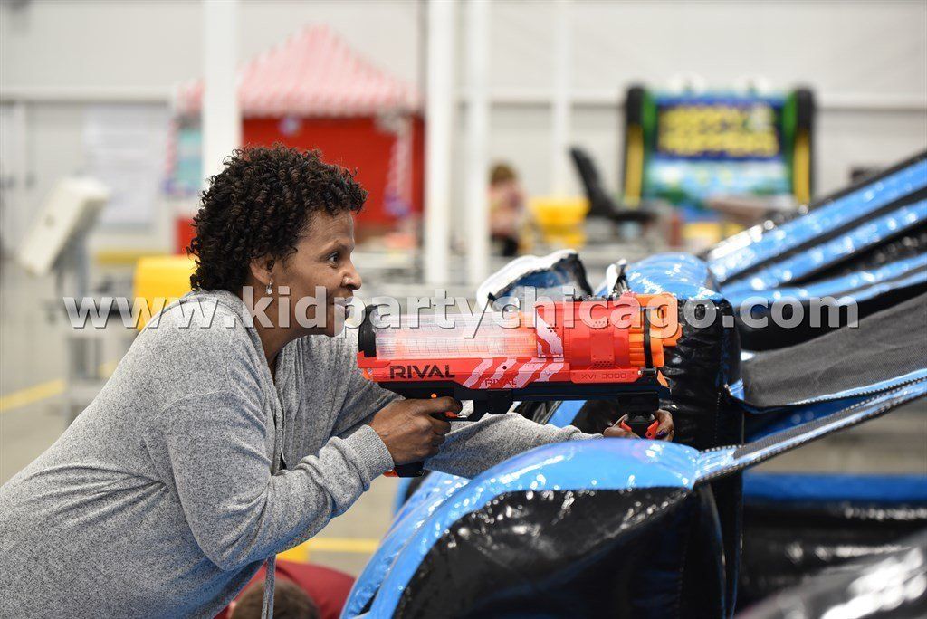 kid party chicago inflatable shooting gallery rental adult competing