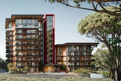 Modern multi-story building with wooden accents, glass windows, and a red elevator shaft.