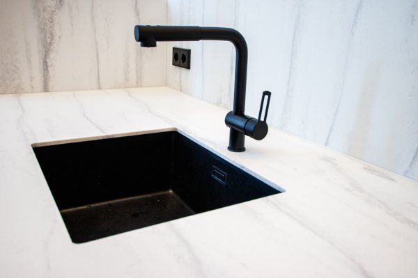 newly installed faucet in the kitchen sink