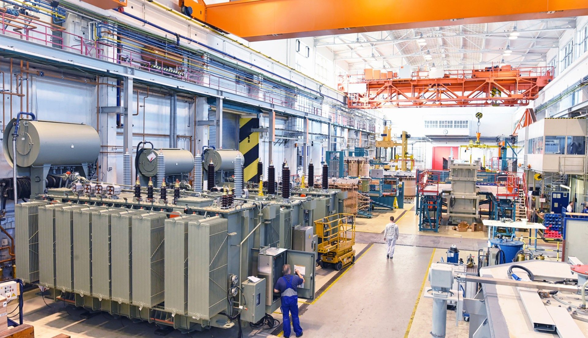 A large factory filled with lots of machinery and workers.