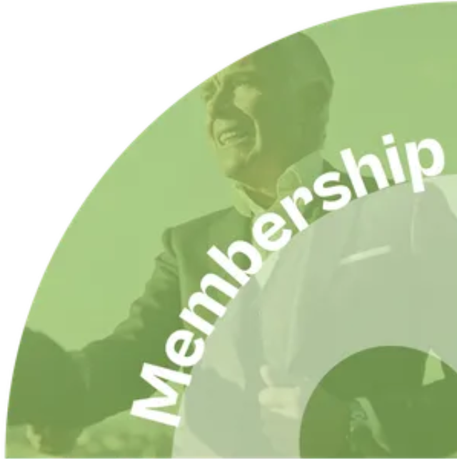 A man in a suit and tie is standing in a green circle with the word membership written on it.