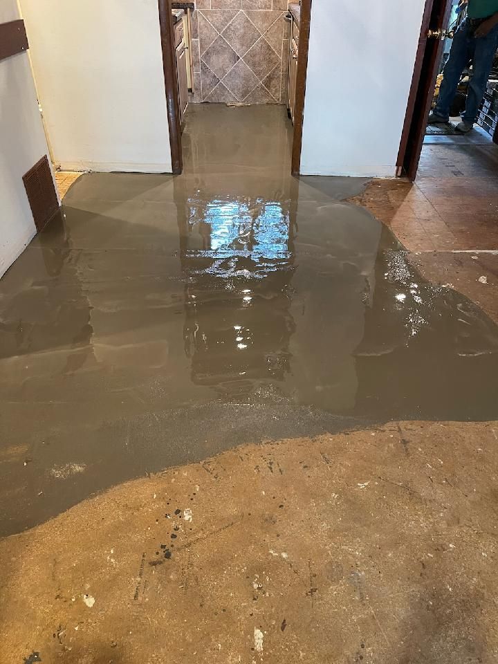 A room with a lot of water on the floor.