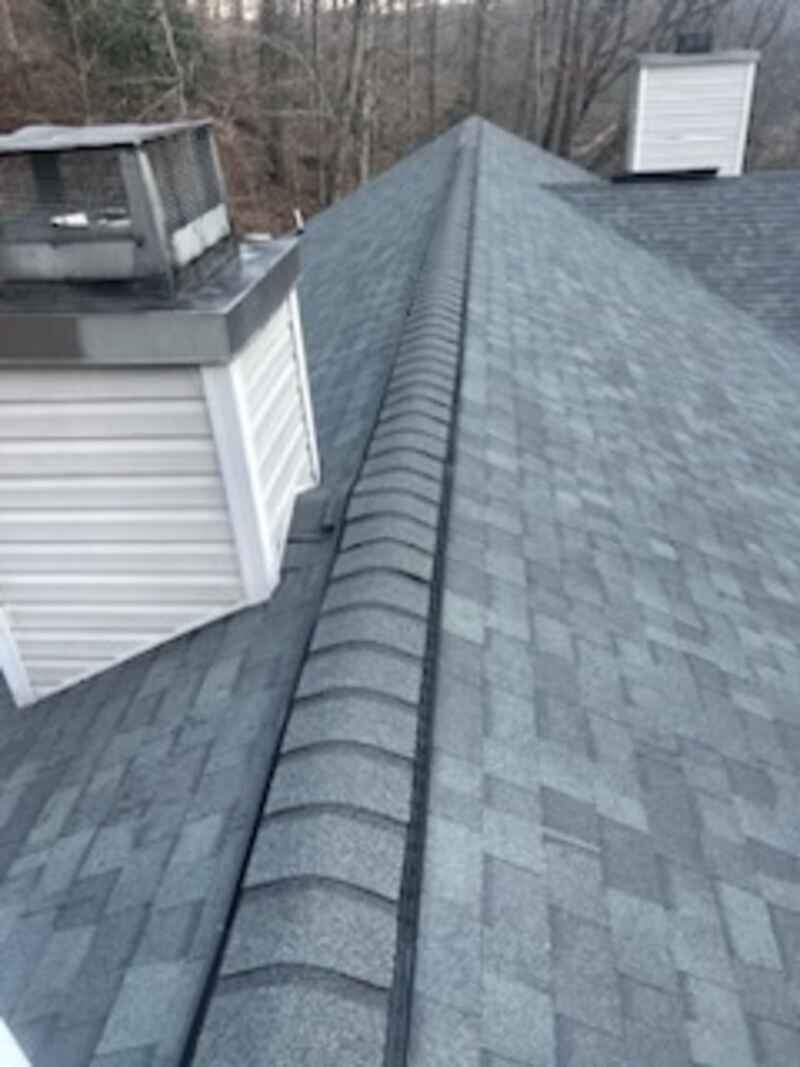 A roof with a chimney on top of it.