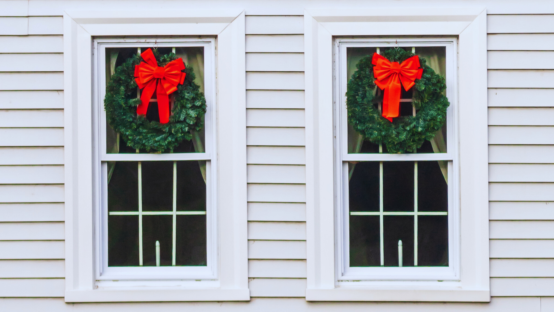 single hung windows with wreaths hanging